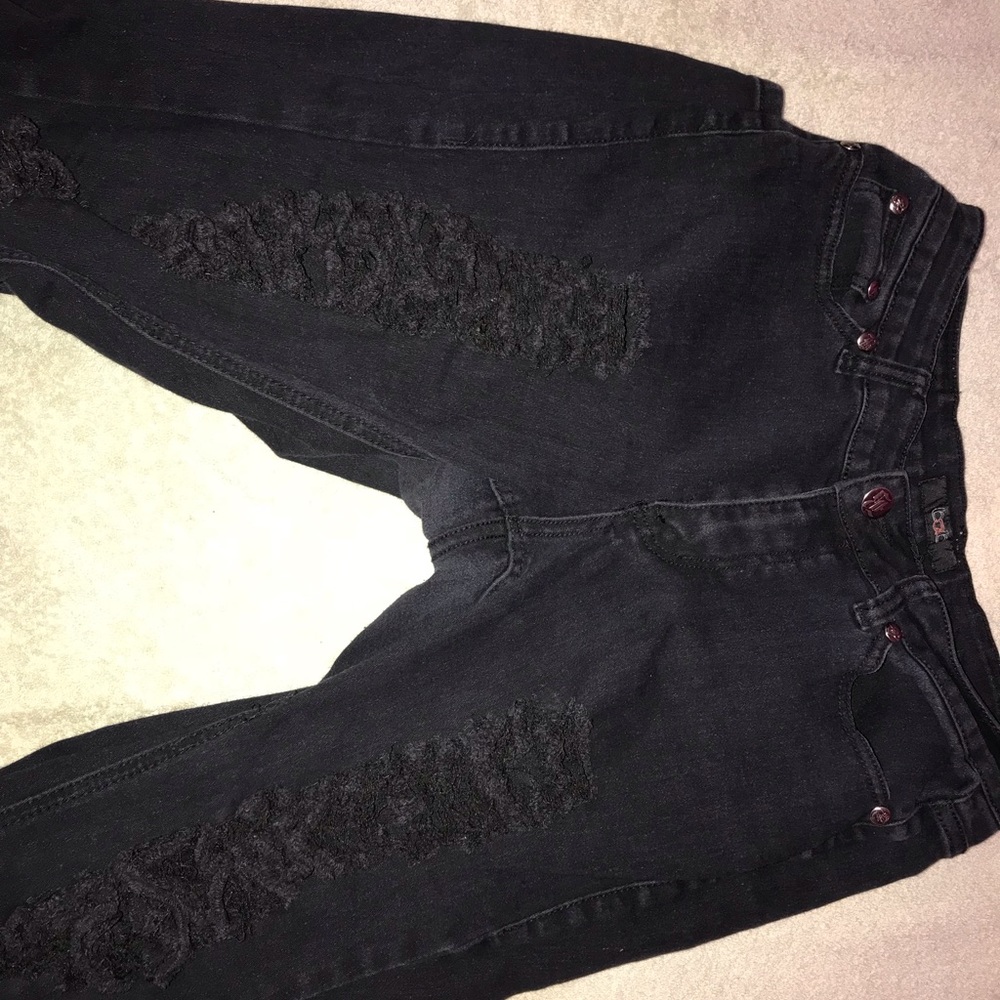 Faded black distressed jeans